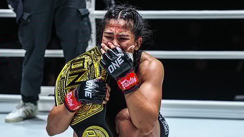 Denice Zamboanga breaks down in tears following a masterful conquest of Alyona Rassohyna of Ukraine that made her the first Filipina to win an MMA world title in the women’s atomweight division of the ONE Fight Night 27 on Saturday in Bangkok.