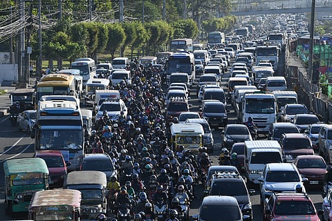 Heavy traffic along a road in Manila. 