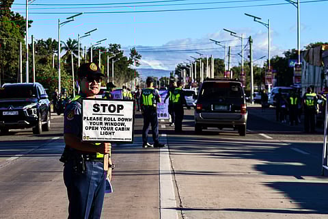 Members of the Philippine National Police in Ilocos Norte conduct checkpoints on Sunday following the election gun ban proclaimed by the Commission on Elections. Authorities ensure strict enforcement of election-related rules to maintain a peaceful and orderly environment leading to the 2025 midterm elections.