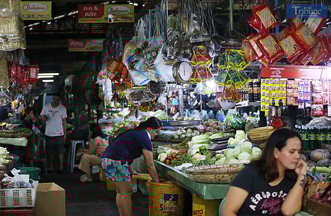 On Saturday, 18 January 2025, customers purchase basic goods at a Quezon City market. The Department of Trade and Industry (DTI) has approved increases in suggested retail prices (SRP) for 63 stock keeping units (SKUs) of basic goods, which will take effect on 1 February.