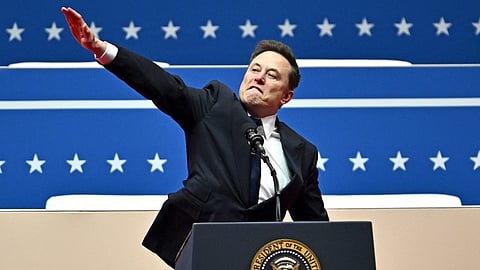 Tesla and SpaceX CEO Elon Musk gestures as he speaks during the inaugural parade inside Capital One Arena, in Washington, DC, on 20 January 2025.