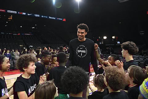 Victor Wembanyama takes time out from his busy schedule for the San Antonio Spurs during the NBA Cares program on the eve of the squad’s game against the Indiana Pacers.