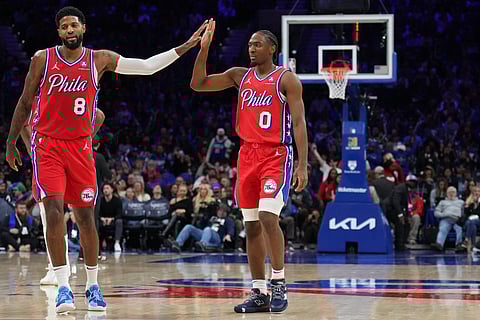 Paul George (left) and Tyrese Maxey join hands for 59 points to power the Philadelphia 76ers past the league-leading Cleveland Cavaliers, 132-129, in their NBA regular season game on Friday.
