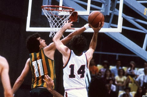 Yugoslavian Drazen Dalipagic (#14) goes for the basket in a semi-final match between Yugoslavia and Brazil on July 30, 1980 in Moscow. 
