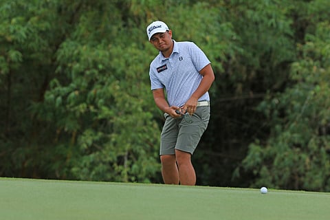 Solo leader Clyde Mondilla watches his putt on the fourth green during the second round of The Country Club Invitational at the TCC course in Laguna on Wednesday.