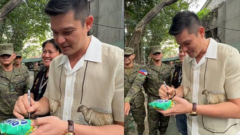 Dingdong Dantes signs all time Filipino snack during an event 