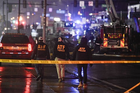 Emergency service members respond to a plane crash in a neighborhood near Cottman Avenue 