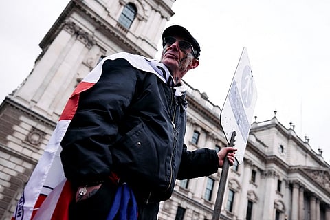 A supporter of Britain's notorious anti-Muslim agitator, Stephen Yaxley-Lennon, also known as Tommy Robinson takes part in a rally in support of Tommy and "other political prisoners" in London on 1 February 2025.
