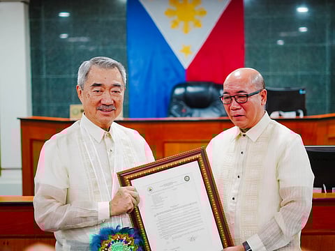 Hon. Hans T. Sy, Adopted Son and Honorary Mayor, receives from Bacolod Vice Mayor El Cid Familiaran a copy of the city council’s resolution during the Sangguninang Panlungsod’s regular session January 30th. The council unanimously passed the resolution declaring Sy Bacolod’s adopted son as he “made exceptional contributions to economic development, business leadership, and philanthropy, serving as an enduring role model for community progress and innovation.” 
