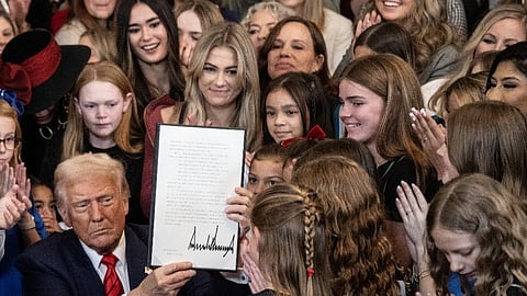 US President Donald Trump holds up the No Men in Women's Sports Executive Order after signing it in the East Room of the White House in Washington, DC, on 5 February 2025.