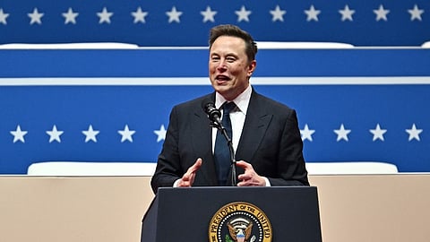 Tesla and SpaceX CEO Elon Musk gestures as he speaks during the inaugural parade inside Capital One Arena, in Washington, DC, on 20 January 2025.