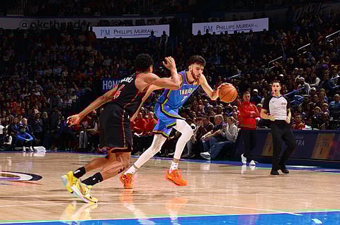  Chet Holmgren #7 of the Oklahoma City Thunder handles the ball during the game against the Toronto Raptors on February 7, 2025 at Paycom Center in Oklahoma City, Oklahoma. 
