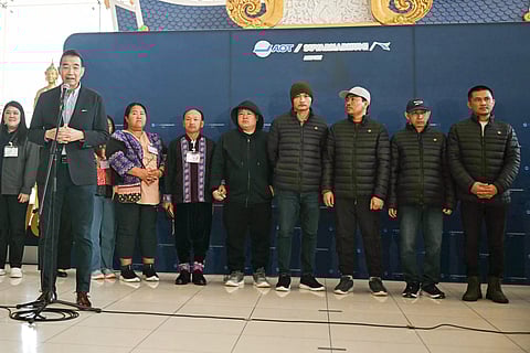 Thai Foreign Minister Maris Sangiampongsa (L) speaks as Thai nationals Surasak Rumnao, Sayhian Suwannkham, Bannawat Saethao, Watchara Sriaoun and Pongsak Thaenna look on during a press conference after their return to Thailand at Bangkok's Suvarnabhumi Airport on 9 February 2025, following their release in a hostage-prisoner exchange between Israel and Hamas as part of a ceasefire deal.