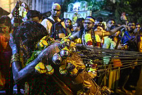 MALAYSIAN Hindu devotee reacts in a state of trance with his back pierced with hooks before he makes his way towards the Batu Caves temple during the Thaipusam festival at Batu Caves on the outskirts of Kuala Lumpur, Malaysia on 11 February 2025. 