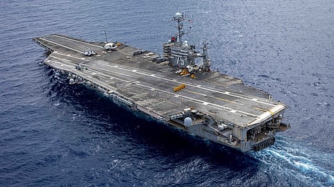 In this handout image provided by the US NAVY the Nimitz-class aircraft carrier USS Harry S. Truman (CVN 75) transits the Atlantic Ocean during an ordnance transfer, 24 August 2024.