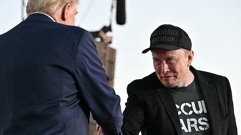 (FILES) Tesla CEO Elon Musk (R) joins former US President and Republican presidential candidate Donald Trump during a campaign rally at site of his first assassination attempt in Butler, Pennsylvania on October 5, 2024. Donald Trump announced 12 November 2024 that the world's richest man, Elon Musk, will lead a new US government efficiency group tasked with cutting federal waste, as the Republican president-elect added a series of seasoned figures and hardliners to his incoming administration. Musk became a key ally to Trump during his campaign, reportedly spending over $100 million to help the Republican win and repeatedly boosting Trump's candidacy on X, the platform he owns.