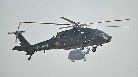 A Chinese Harbin Z-20 utility helicopter flies during the 15th China International Aviation and Aerospace Exhibition in Zhuhai, in south China's Guangdong province on November 12, 2024. The 15th China International Aviation and Aerospace Exhibition, held in the southern city of Zhuhai, will showcase military fighters, passenger jets, drones and weapons systems, some for the first time in public.