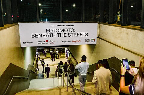 Pedestrians enter the Legazpi underpass where FotoMoto digital exhibit is held.