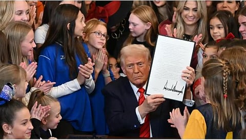 Donald Trump signs an executive order targeting transgender althetes, February 5, 2025 at the White House
