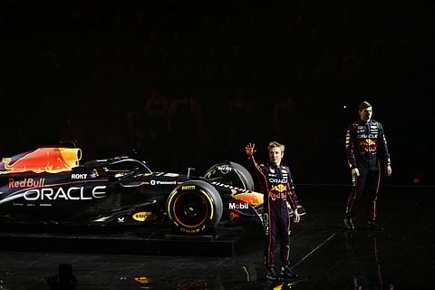 Max Verstappen and Red Bull Racing’s New Zealand driver Liam Lawson stand by the new Formula 1 car of Red Bull Racing Formula One Team.