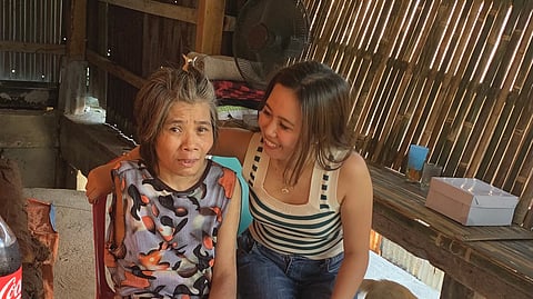 Fe offers her mother a reassuring smile.