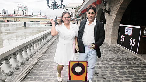 A couple makes memories at the Binondo-Intramuros Bridge as part of their prenuptial preparations and events.  