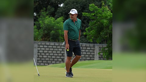 Angelo Que survives the fierce winds to hammer a 71 for a three-shot lead in the second round of the ICTSI Pradera Verde Championship at the Pinatubo course on Tuesday.