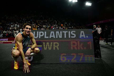 Armand Duplantis smiles after completing a record-breaking performance of 6.27 meters in the All-Star Pole Vault in Clermont-Ferrand, France.  