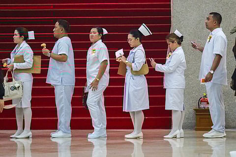 [FILES] NEWLY registered nurses line up to enter their oath-taking ceremony last December at the Plenary Hall of the Philippine International Convention Center, CCP Complex, Roxas Boulevard, Pasay City. The Department of Migrant Workers has announced that it is now accepting applications from nurses and care workers interested in working in Japan under the Japan-Philippines Economic Partnership Agreement.