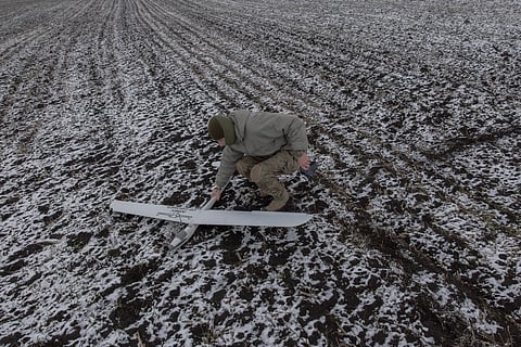 A Ukrainian member an Azov Brigade drone team - callsign Sava, 21 - collects a surveillance drone after a flight near Russian positions, in the direction of Toretsk, eastern Donetsk region, on 4 February 2025, amid the Russian invasion of Ukraine. The Azov Battalion became a household name in Ukraine weeks after Russia invaded Ukraine in 2022 for its last-ditch defense of the southern city of Mariupol. It held out in bunkers beneath the city's sprawling metal works before surrendering to the Russian forces that had laid a brutal siege to the city, with most of the Azov fighters captured in the siege still in captivity. Since Mariupol, it is one of Ukraine's most celebrated and respected units, deployed to turn the tide of events in the most difficult areas of the front line.