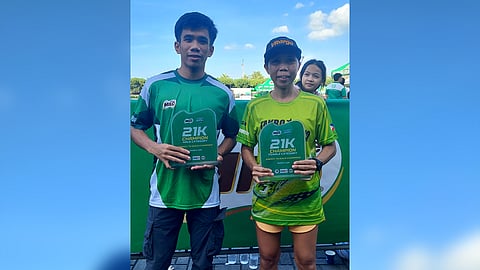 Ritchie Estampador (left) and Maricar Camacho beam with pride after ruling the Pasay leg of the Milo Marathon on Sunday morning.