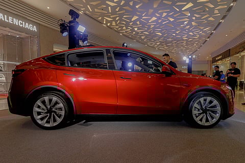 The New Tesla Model Y turns heads in striking red.
