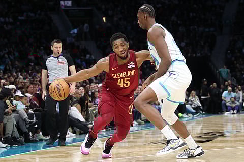 Donovan Mitchell leads the way as the Cleveland Cavaliers rally past the Charlotte Hornets, 118-117, in their NBA regular season game.