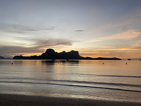 Weekend vibe Golden hues paint the sky as the sun sets over El Nido’s serene shores, offering a moment of pure tranquility.