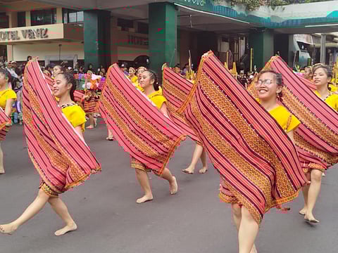Women perform during the Panagbenga Festival parade in Baguio City. 
