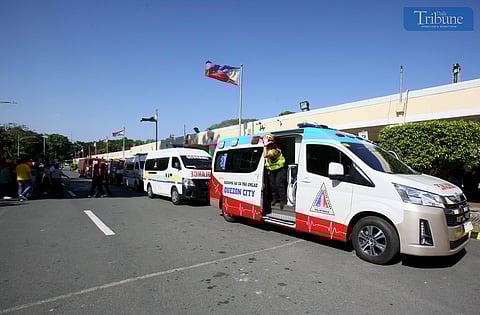 Employees from Quezon City Hall evacuate the buildings as they participate in the first quarter simultaneous earthquake drill on Thursday, 13 March 2025.