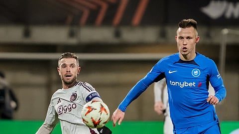 FK RFS' Latvian midfielder #09 Janis Ikaunieks and Ajax's English midfielder #06 Jordan Henderson vie for the ball during the UEFA Europa League football match between FK RFS and AFC Ajax in Riga on 23 January 2025.
