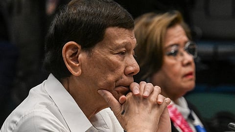 Former Philippine president Rodrigo Duterte (L) and former senator and human rights campaigner Leila de Lima (R) attend a senate probe on the drug war during Duterte's administration, in Manila on 28 October 2024.