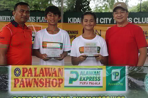 JAN Gecosala (second from left) and Shaner Gabaldon hold their trophies as they pose with Kidapawan City Tennis Club president Arnold Embudo (left) and former KCTC head Ronald Barrios after securing two titles each in the PPS-PEPP Pres. Arnold Embudo National Junior Tennis Championships in Kidapawan City, Cotabato.