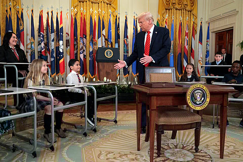 PRESIDENT Donald Trump greets school children before signing an executive order to reduce the size and scope of the Education Department during a ceremony in the East Room of the White House on 20 March 2025 in Washington, DC. 