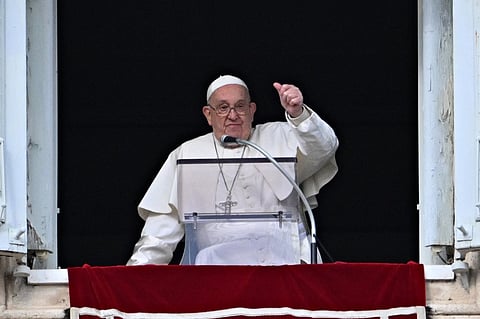 (FILES) Pope Francis gestures to the crowd from the window of the Apostolic Palace overlooking St Peter's Square during the Epiphany Angelus prayer, in the Vatican, on 6 January 2025. Pope Francis will make his first public appearance on 22 March, 2025 with a blessing and a wave from a window at Rome's Gemelli hospital where he was admitted on 14 February.
