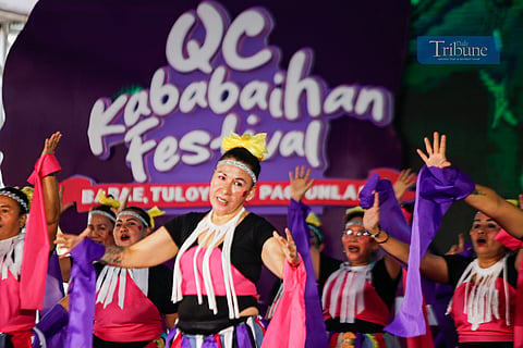 Women from various barangays in Quezon City compete in the Kababaihan Festival dance competition at the Quezon City Hall compound on 24 March 2025. Contestants also showcase costumes made from upcycled materials.