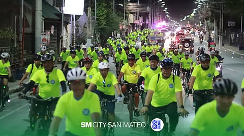 BIKERS pedal at SM City San Mateo to promote energy conservation. 