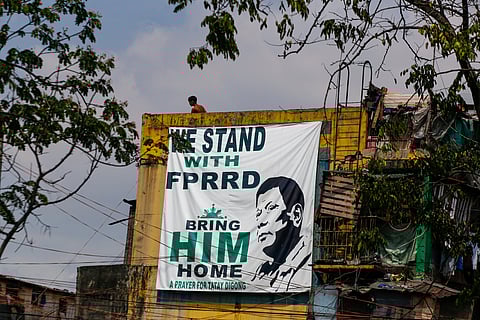 A giant tarpaulin showing support for former President Rodrigo Duterte is displayed on a residential building along Road 10, Tondo, Manila, on Monday. Duterte is currently detained by the International Criminal Court in The Hague, awaiting trial for crimes against humanity.