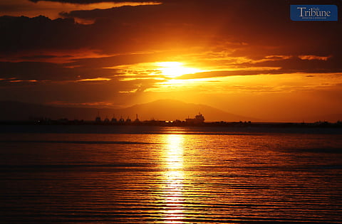 Local tourists spend time at Dolomite Beach at Manila Bay in Manila to watch the sunset on Sunday, 30 March 2025.