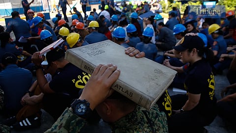 MANILA'S FINEST. Personnel from the Manila Police District join the first quarter nationwide simultaneous earthquake drill at MPD grounds in UN Avenue, Manila, on 13 March 2025. The earthquake drill is a quarterly exercise to enhance the preparedness of the various agencies and local government units and educate the public on earthquake preparedness measures.