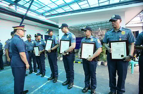 Philippine National Police chief Police General Rommel Marbil congratulates the eighth Antipolo police personnel in their accomplishment during the awarding of medals at the Antipolo Component City Police Station. The recognition is given for their swift arrest of the suspect in a road rage incident that occurred along Marcos Highway in Sitio Calumpang, Barangay San Jose, Antipolo, on Sunday afternoon. 
