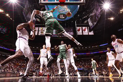 Giannis Antetokounmpo and the Milwaukee Bucks rev up for the NBA post-season with a 121-115 win over the Miami Heat.