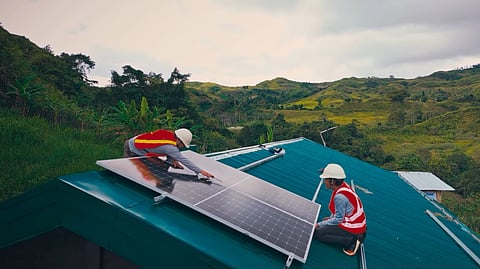 DAVAO Light and Power Company technicians install solar panels on the roof of Kabangbang Elementary School in Barangay Gumitan, Marilog District, Davao City under the AuroraPH program of Aboitiz Foundation. 
