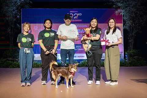 Meralco Vice President and Head of Corporate Communications Joe R. Zaldarriaga (center) and Head of Advocacy Communications Management Michelle Caguioa (rightmost) presented the certificate of appreciation to PAWS Executive Director Atty. Anna Cabrera (2nd from right) for being one of the keynote speakers in the event, joined on stage by two PAWS volunteers and rescued dogs.